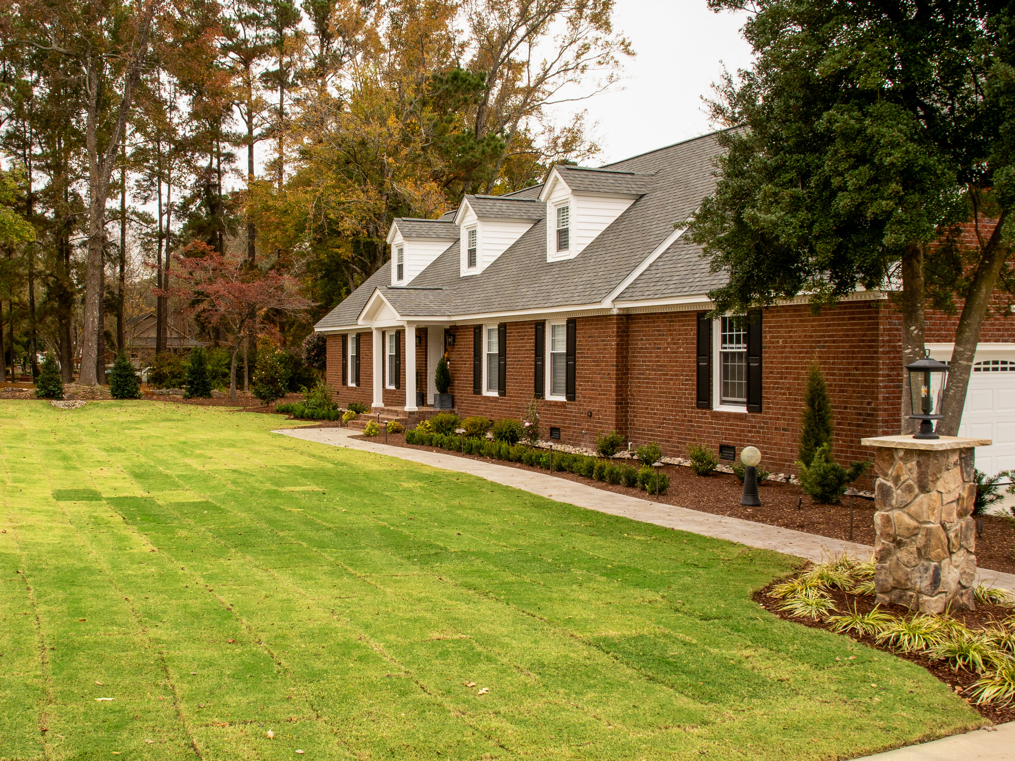 Lush landscape planting design by Yardie Design, Eastern NC